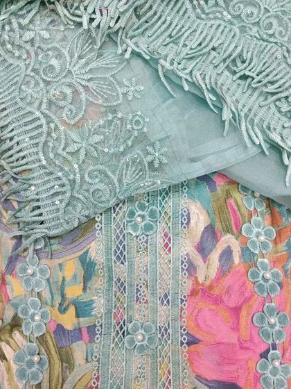 For Mother's Day, indulge her with a stunning suit piece she's been dreaming of, like this one with a beautifully embroidered and fringed dupatta.