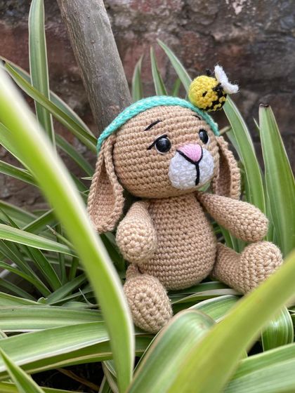 A slightly different angle of Oliver the Bunny, showing how peacefully he sits. He's a perfect example of a classic handmade toy.