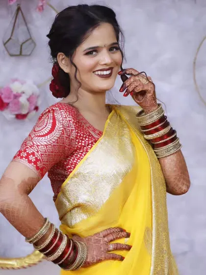 A confident and happy pose from the bride, showing off her beautiful smile and makeup.