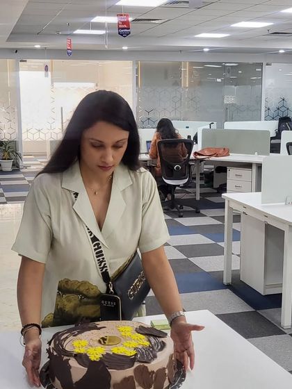 What brings everyone together at a celebration? Cake! Here I am delivering a large chocolate cake for a corporate birthday party.