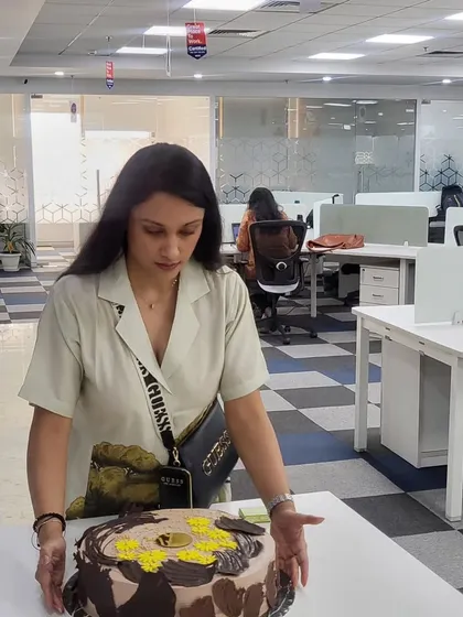 What brings everyone together at a celebration? Cake! Here I am delivering a large chocolate cake for a corporate birthday party.