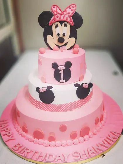 This three-tier Minnie Mouse cake was a treat to make. Each tier was a different one of our bestselling flavors: butterscotch, strawberry, and black forest.