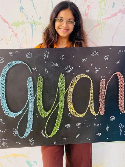 A custom string art name board being created for a special gift. We love helping people make personalized and meaningful art.