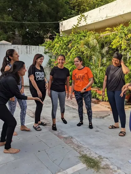 A candid moment of fun and games before we get into our workout. Laughter is the best warm-up exercise!