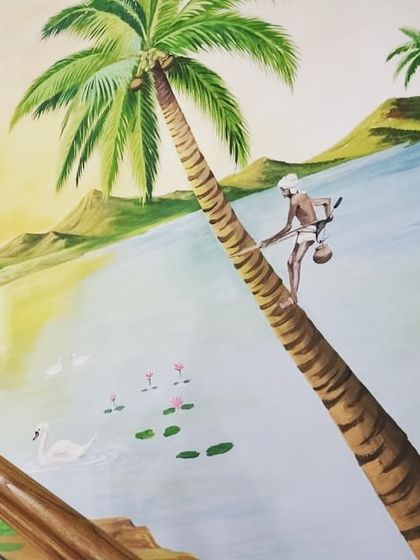 A clear, bright shot of the completed tropical scene mural. The details of the toddy tapper on the palm tree, the swans, and the distant hills are clearly visible, showcasing the storytelling aspect of the art.