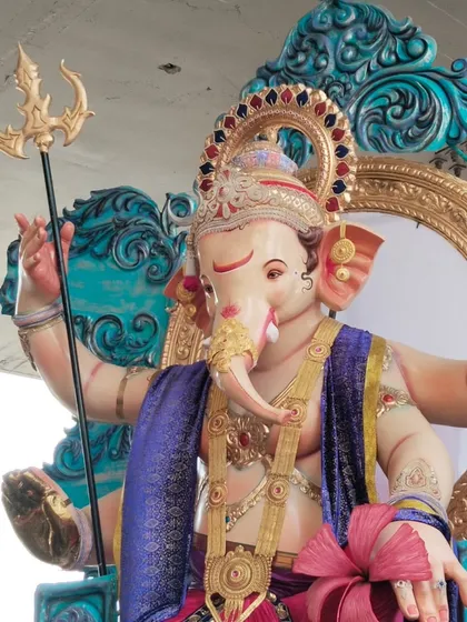 Another perspective of the Kamathipura cha Mahaganpati, focusing on the upper body. You can see the fine details of the crown, the trishul, and the gentle expression on Bappa's face.
