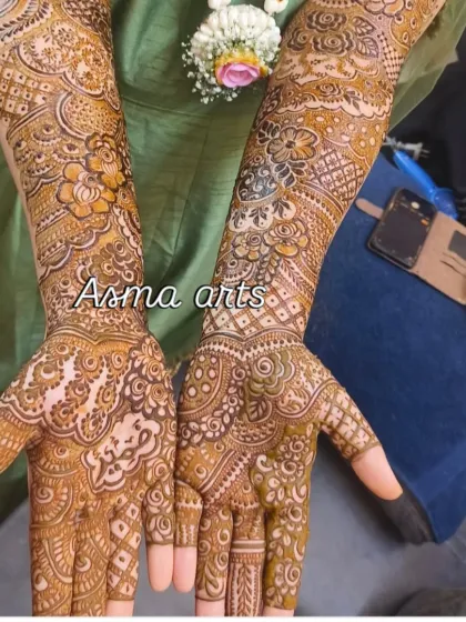 This design shows a beautiful symmetry between both arms, with matching floral and paisley elements that create a cohesive and balanced traditional look.