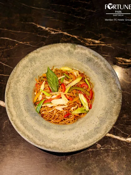 A delicious bowl of Hakka noodles, tossed with crisp vegetables and seasoned to perfection.
