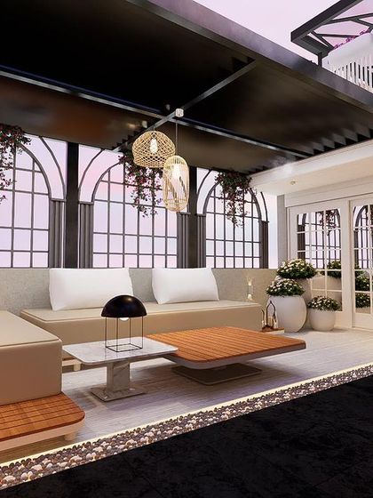 A close-up of the seating area under the pergola at "The Palms" project. The arched window designs and hanging pendant lights add to the elegant, European feel of the space.