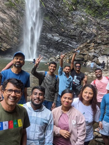 A happy group selfie at the base of Koodluthirtha Falls.
