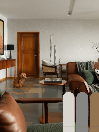This image showcases the color palette of our Indian Heritage home. Earthy tones of green, brown, and grey, combined with the warmth of wood and leather, create a calming and sophisticated atmosphere.