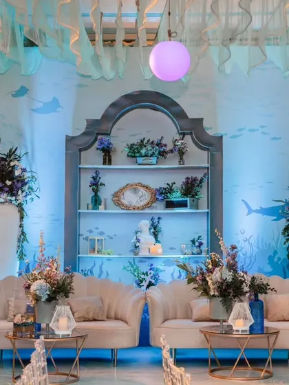 An elegant lounge area within the 'Under the Sea' party. I created a sophisticated seating space with plush sofas and themed decor, offering a comfortable retreat for adult guests.