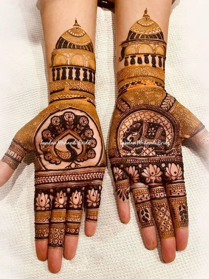 The beauty of traditional art is in the details. This design combines classic motifs like the royal elephant and the graceful peacock, framed by intricate architectural patterns, for a rich and timeless look.