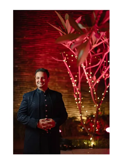 The groom looking dapper and ready for the Sangeet night. We take portraits that capture the mood and style of each event.