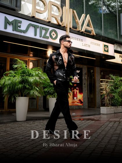 Walking with purpose in the black utility shirt. This look is designed for the man who is always on the move and dressed to command.