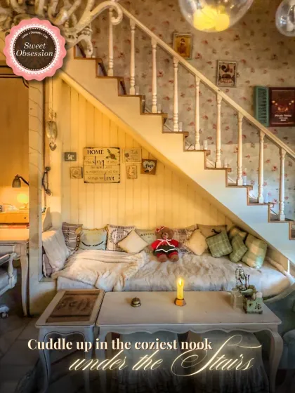 I call this the coziest nook in the cafe, tucked right under the stairs. It’s filled with plush cushions and warm light, making it the perfect spot to cuddle up with a loved one for a quiet, intimate conversation.