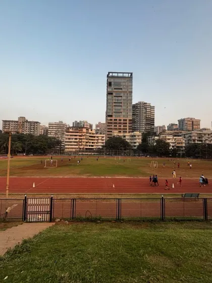 A panoramic view of our athletics track and football field, with the Mumbai skyline in the background. This image captures our unique blend of world class sports facilities and urban nature.