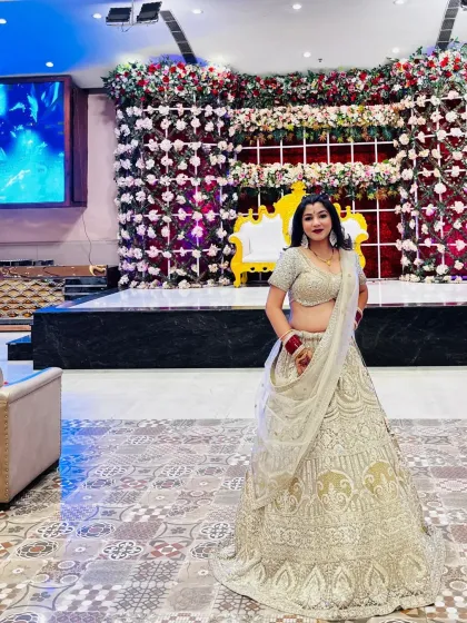 A series of photos of my happy client looking absolutely stunning in a heavily embroidered silver-grey lehenga at her reception. She owned the look completely!