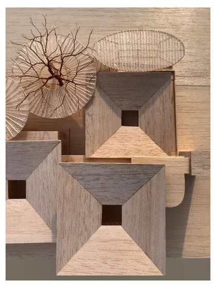 A closer look at the pinwheel arrangement of the learning pods in the architectural model.