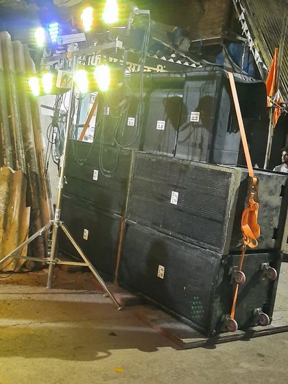Another angle of the heavy-duty speaker stack, secured and ready for a high-volume event. This is the kind of power needed for procession music or large outdoor parties.