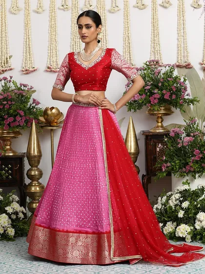 The flow of the lehenga skirt and dupatta is captured beautifully in this shot.
