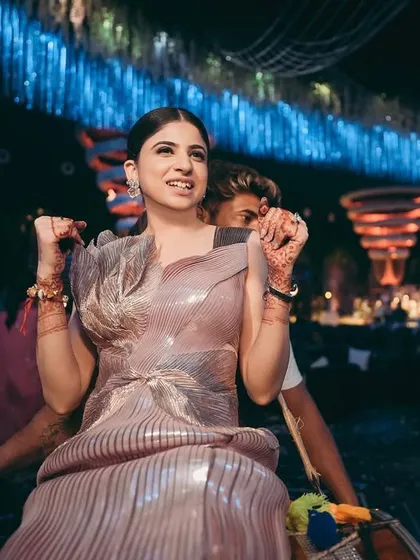 The bride enjoying the party. This look was all about fun and glamour, with makeup and hair that stayed perfect through a night of dancing.