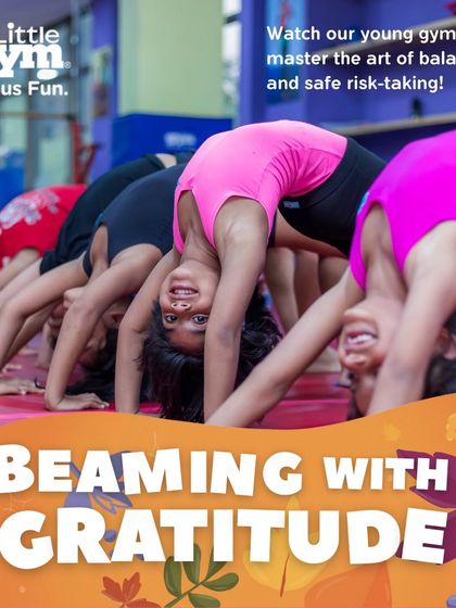 A group of young gymnasts practices their backbends together. This group activity fosters a sense of camaraderie while they work on flexibility and strength, learning to support and encourage one another.