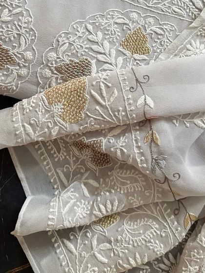 A detail shot of the sleeve, showing the beautiful border embroidery.