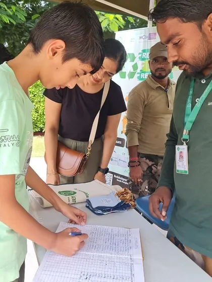 At RPS International School, 43 families joined forces to collect 238 kgs of dry waste. Here, a student registers his family's contribution, taking an active role in our community recycling drive.