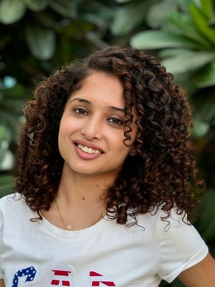 A perfect example of healthy, colored curls. I added subtle highlights to her hair to give it dimension while keeping the curls defined and frizz-free.