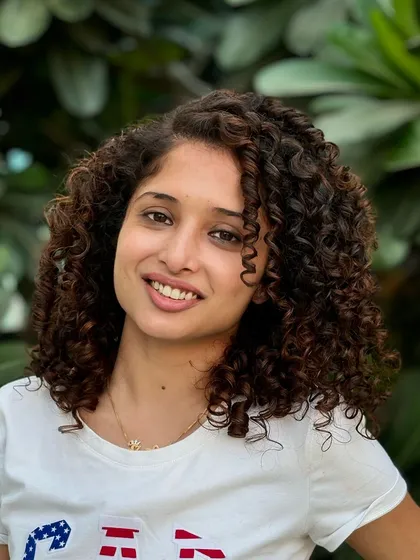 A perfect example of healthy, colored curls. I added subtle highlights to her hair to give it dimension while keeping the curls defined and frizz-free.