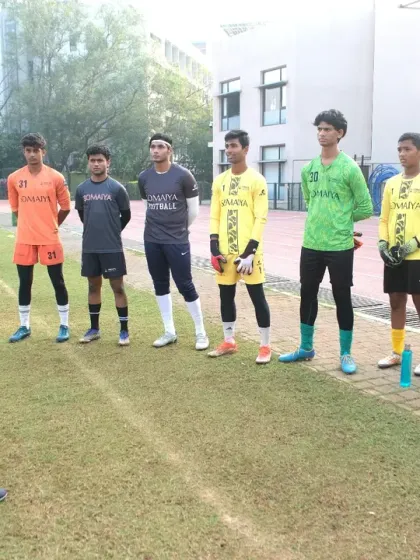 An AIFF certified instructor provides direct feedback to a group of young goalkeepers. Our clinics maintain a low coach-to-participant ratio to ensure every individual receives personalized attention and guidance.
