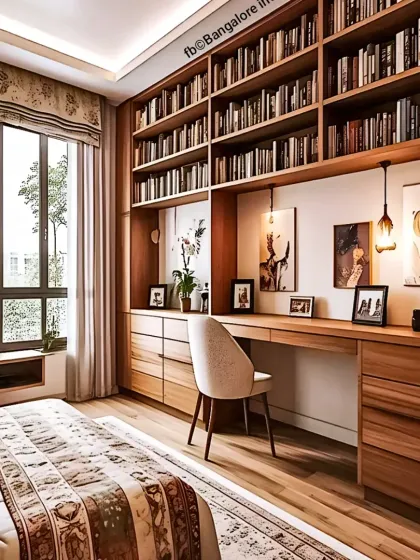 Here, I integrated a spacious work desk and a floor-to-ceiling library into a master bedroom. This custom solution provides extensive storage and a dedicated workspace without compromising the room's relaxing feel, using warm wood to unify the elements.