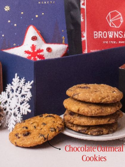 A stack of our classic Chocolate Oatmeal Cookies, a comforting and delicious addition to our Christmas hampers. These are handcrafted and have that perfect homemade taste that everyone loves during the holidays.