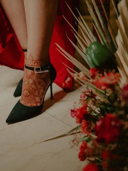 This photo shows how beautifully a henna stain on the foot can look. The rich, dark color of the mandala design stands out and looks stunning paired with elegant heels.