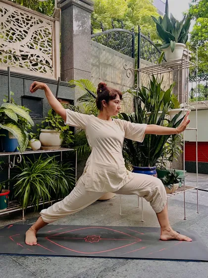 Here I am demonstrating a Tai Chi posture, a practice I call moving meditation. This ancient art is about finding focus and internal strength through slow, deliberate movement. It is an excellent way to ground your energy and reset your nervous system, especially if you find it difficult to sit still.