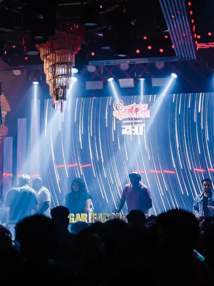 A dramatic shot of the stage and lighting setup at Sugar Factory.