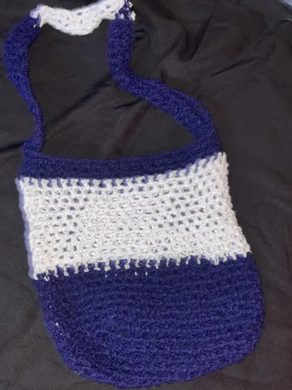 Another shot of the two-tone mesh shoulder bag. It's great for the beach or just carrying a few things around town.