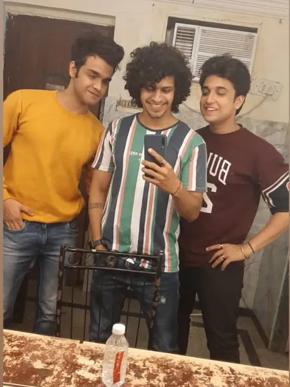 A candid moment with my co-actors behind the scenes. It's all about the hustle, but we always find time for a smile. Positive vibes on set are a must!