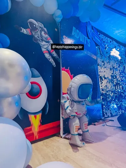 An astronaut has landed at the party. This life-sized astronaut cutout was a huge hit with the kids and a perfect photo prop for the space-themed birthday celebration.
