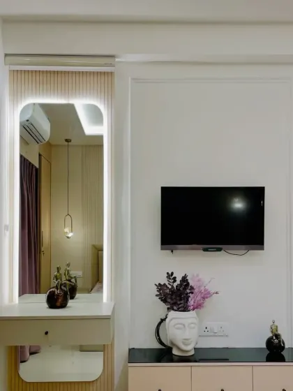 A full view of the vanity and TV area, showing how we create multi-functional zones within a bedroom using custom furniture and thoughtful design.