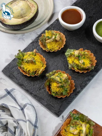 A gourmet glow-up for a street food favorite. My Avocado Mousse Chaat in crisp phyllo cups is a testament to my innovative approach to catering, perfect for stylish soirées and modern events.