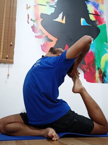 A deep expression of One-Legged King Pigeon Pose, highlighting the dedication of our students.