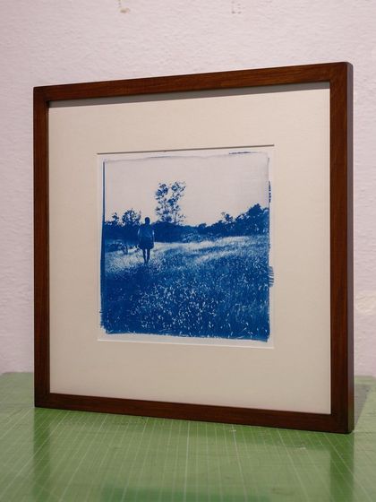 This framed cyanotype print of a figure in a landscape is ready to be displayed. I work with local framers to provide archival framing solutions for your commissioned artwork.