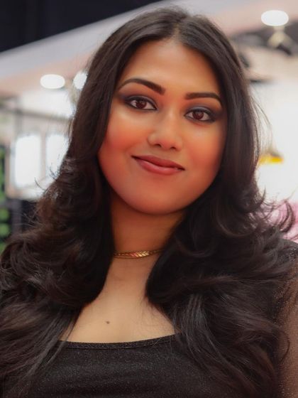 A portrait of the model, showing how the haircut and makeup come together for a complete, professional look.