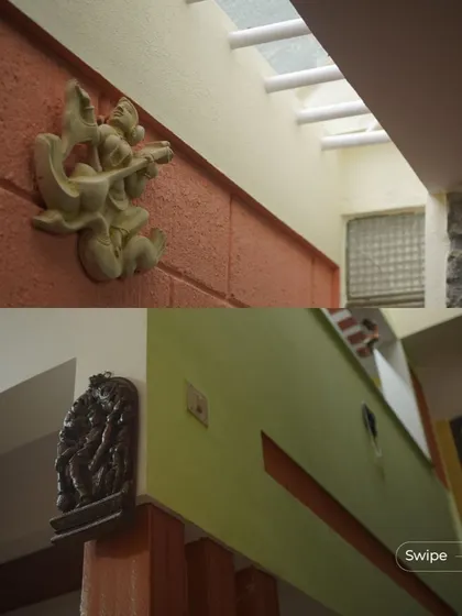 Details of traditional art pieces placed against terracotta and stone walls, highlighting the cultural richness embedded in the home's design.