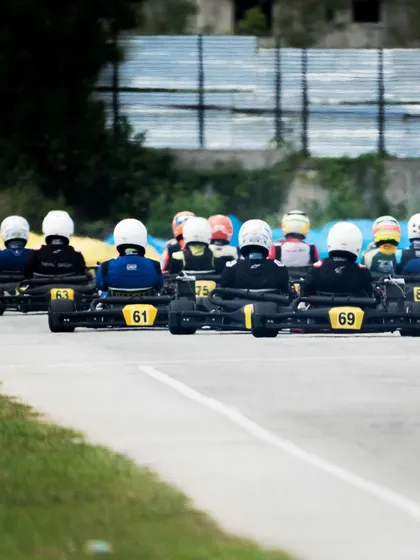 The view from behind the grid, showing the karts lined up before the start.