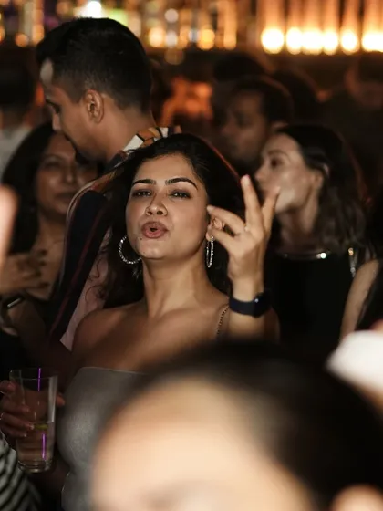 A guest vibing to the music on a packed Saturday night at Kaze.