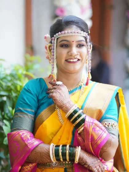 A happy and confident bride. The makeup is perfectly balanced, with a neutral eye and a pop of color on the lips.