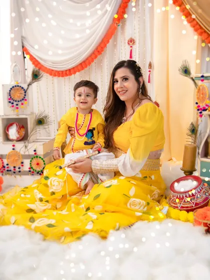 A festive Janmashtami celebration. We created this beautiful, traditional setup with peacock feathers and marigolds for a unique and culturally rich photoshoot.